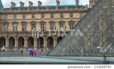 Old and new element at louvre external building timelapse. Paris, France Old and new element at louvre external building timelapse. Paris, France 133689785