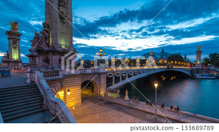 Alexandre Bridge in Paris at night in illumination day to night timelapse. Paris, France Alexandre Bridge in Paris at night in illumination day to night timelapse. Paris, France 133689789