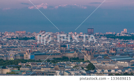 Aerial view of a large city skyline at sunset timelapse. Top view from the Eiffel tower. Paris, France. Aerial view of a large city skyline at sunset timelapse. Top view from the Eiffel tower. Paris, France. 133689815