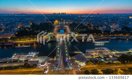 Aerial view over Trocadero day to night timelapse with the Palais de Chaillot seen from the Eiffel Tower in Paris, France. Aerial view over Trocadero day to night timelapse with the Palais de Chaillot seen from the Eiffel Tower in Paris, France. 133689817