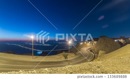 Day to night timelapse with rocks from Jebel Hafeetwith impressive view over the city. 133689886