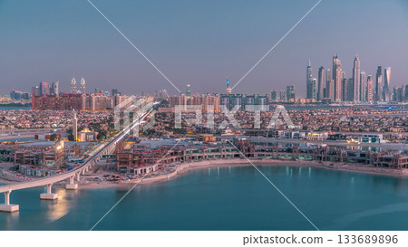 Jumeirah Palm island skyline day to night timelapse in Dubai, UAE. Jumeirah Palm island skyline day to night timelapse in Dubai, UAE. 133689896