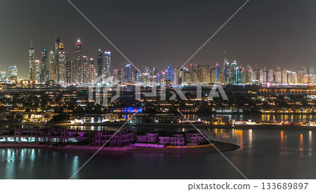 Jumeirah Palm island skyline night timelapse in Dubai, UAE. Jumeirah Palm island skyline night timelapse in Dubai, UAE. 133689897