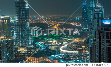 Aerial view of Dubai downtown Lake area night timelapse and skyscrapers 133689923