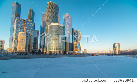 Moscow City skyscrapers in winter at sunset timelapse. Moscow City skyscrapers in winter at sunset timelapse. 133689941