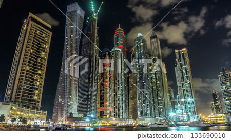 Close view of Dubai Marina tallest towers in Dubai at night timelapse Close view of Dubai Marina tallest towers in Dubai at night timelapse 133690010