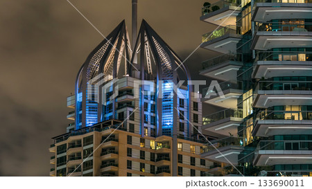 Close up view of Dubai Marina tallest towers in Dubai at night timelapse Close up view of Dubai Marina tallest towers in Dubai at night timelapse 133690011