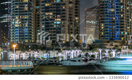 Promenade in Dubai Marina timelapse at night, UAE. Promenade in Dubai Marina timelapse at night, UAE. 133690012