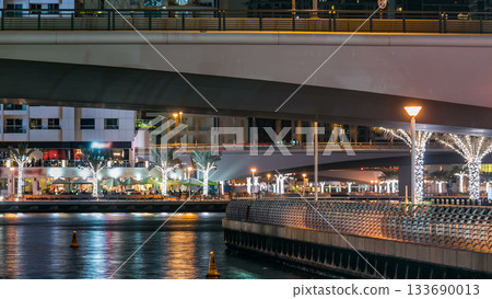 Promenade in Dubai Marina timelapse at night, UAE. Promenade in Dubai Marina timelapse at night, UAE. 133690013