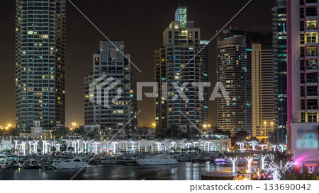 Promenade and canal in Dubai Marina timelapse at night, UAE. Promenade and canal in Dubai Marina timelapse at night, UAE. 133690042