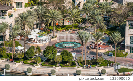 Fountain and palms timelapse at the marina walk, During day time. Dubai, UAE Fountain and palms timelapse at the marina walk, During day time. Dubai, UAE 133690050