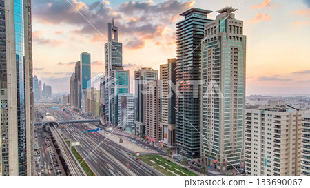 Downtown Dubai towers in the evening timelapse. Aerial view of Sheikh Zayed road with skyscrapers at sunset. Downtown Dubai towers in the evening timelapse. Aerial view of Sheikh Zayed road with skyscrapers at sunset. 133690067