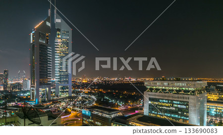 Dubai skyline from top with Emirates Towers timelapse at night time. Dubai, UAE. Dubai skyline from top with Emirates Towers timelapse at night time. Dubai, UAE. 133690083