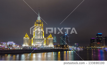 Hotel Ukraine winter night timelapse hyperlapse with bridge over Moscow River. Hotel Ukraine winter night timelapse hyperlapse with bridge over Moscow River. 133690100
