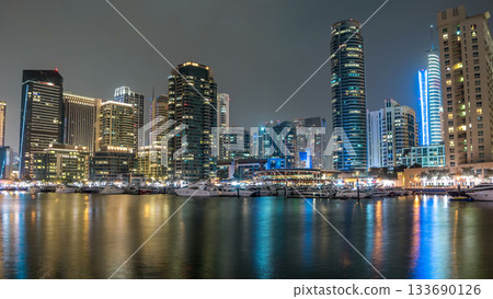 Dubai Marina towers and yacht in Dubai at night timelapse hyperlapse Dubai Marina towers and yacht in Dubai at night timelapse hyperlapse 133690126