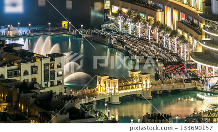 A general view of the bridge over man-made lake timelapse in Dubai downtown, United Arab Emirates. 133690157
