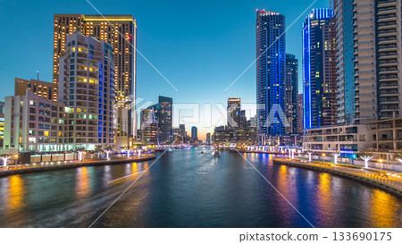 Dubai Marina towers and canal in Dubai day to night timelapse Dubai Marina towers and canal in Dubai day to night timelapse 133690175