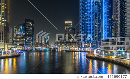 Dubai Marina towers and canal in Dubai night timelapse hyperlapse 133690177