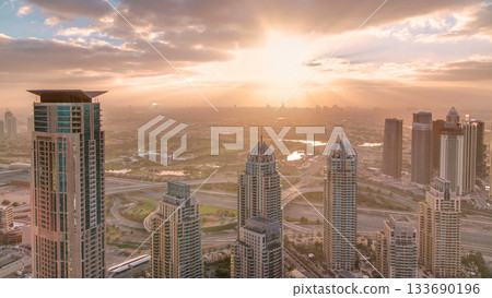 Sunrise in Dubai Marina with towers and harbor with yacht from skyscraper, Dubai, UAE timelapse Sunrise in Dubai Marina with towers and harbor with yacht from skyscraper, Dubai, UAE timelapse 133690196