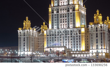 Hotel Ukraine winter night timelapse hyperlapse with bridge over Moscow River. Hotel Ukraine winter night timelapse hyperlapse with bridge over Moscow River. 133690256