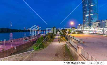 Beautiful cityscape with modern buildings day to night timelapse, the tallest skyscraper in Austria 133690440