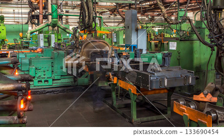 Conveyor assembly stage the body of tractor at big industrial factory timelapse Conveyor assembly stage the body of tractor at big industrial factory timelapse 133690454