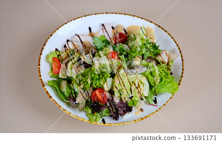 Salad with kale, red oranges and quince. salad with beetroot and avocado, food close-up Leafy vegetable salad Salad with kale, red oranges and quince. salad with beetroot and avocado, food close-up Leafy vegetable salad 133691171