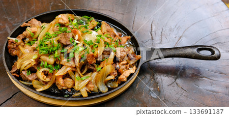 original fajita sizzling smoking hot served on iron plate ,with selection of beer and fresh vegetables on background ,MORE DELICIOUS FOOD ON PORTFOLIO original fajita sizzling smoking hot served on iron plate ,with selection of beer and fresh vegetables on background ,MORE DELICIOUS FOOD ON PORTFOLIO 133691187