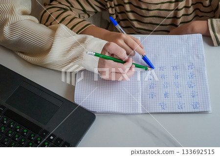 Close-Up of Hands Holding Pen and Notebook Close-Up of Hands Holding Pen and Notebook 133692515