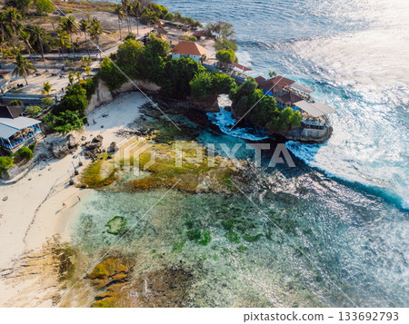 Coastline and ocean with waves in Nusa Ceningan, Bali. Aerial view Coastline and ocean with waves in Nusa Ceningan, Bali. Aerial view 133692793