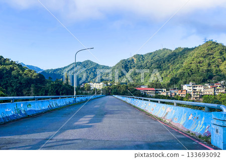 Colorful Bridge with Ocean Mural in Wulai, New Taipei City. 133693092