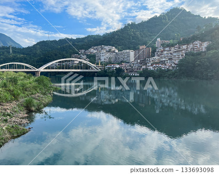 Swallow Lake with Arch Bridge and Riverside Town in Xindian Taiwan. Swallow Lake with Arch Bridge and Riverside Town in Xindian Taiwan. 133693098