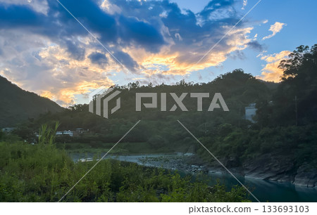 Dawn Sky with Golden Clouds Over Wulai Mountains and River, Taiwan. Dawn Sky with Golden Clouds Over Wulai Mountains and River, Taiwan. 133693103
