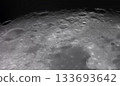 Panoramic view of the Moon surface, showing intricate details of its craters and rugged terrain. The 133693642