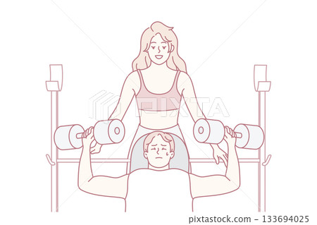 Female and male competitors practicing strength exercises under professional supervision in gym 133694025