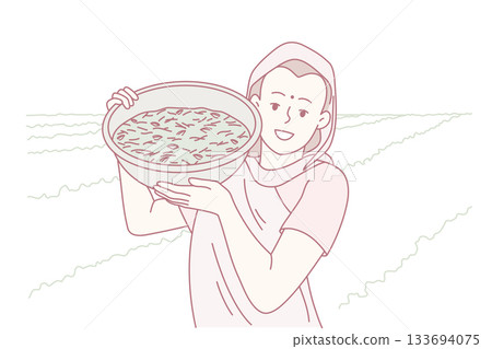 female agricultural worker exhibits basket of recent sea harvests amidst coastal farmland and community life 133694075