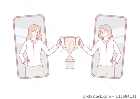Smiling businesswomen holding trophy together Smiling businesswomen holding trophy together 133694131