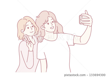 Duo of friends enjoying cheerful photo session with playful expressions and bright atmosphere 133694300