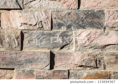 Stone background texture, masonry wall made of rock massif Stone background texture, masonry wall made of rock massif 133694367