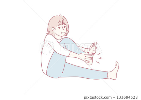 female individual performing soothing foot massage after exercise in peaceful home environment 133694528