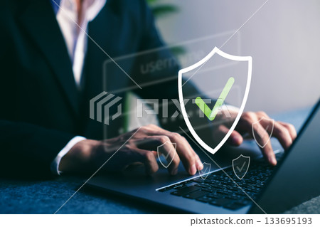 Cybersecurity, Businessman using laptop with secure online login, data protection, and digital privacy in corporate environment. Cybersecurity, Businessman using laptop with secure online login, data protection, and digital privacy in corporate environment. 133695193