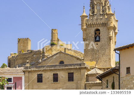 Uncastillo historic architecture presenting church tower and ancient castle Uncastillo historic architecture presenting church tower and ancient castle 133695559