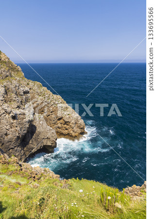 Cantabrian Sea waves crashing against sea cliffs in Spain Cantabrian Sea waves crashing against sea cliffs in Spain 133695566