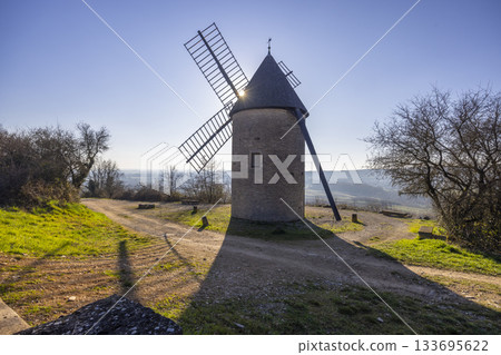 Traditional windmill in Santenay, Bourgogne Franche Comte, France Traditional windmill in Santenay, Bourgogne Franche Comte, France 133695622