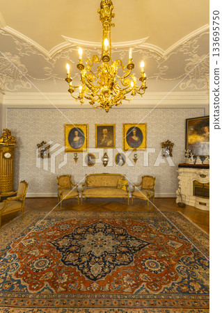 Baroque interior room with chandelier and antique furniture 133695750