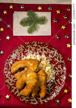 Fried carp and potato salad celebrating festive Christmas dinner 133695777