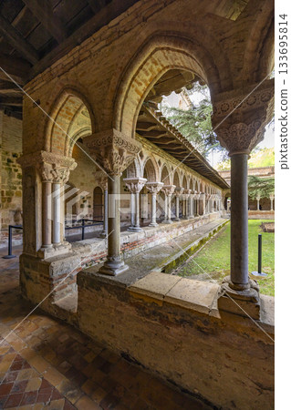 Romanesque cloister arches and columns in Moissac Abbey Romanesque cloister arches and columns in Moissac Abbey 133695814