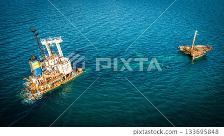 Manassa Rose Shipwreck. Crete. Greece. Aerial Shot. 90 degree take. Blue water Manassa Rose Shipwreck. Crete. Greece. Aerial Shot. 90 degree take. Blue water 133695848