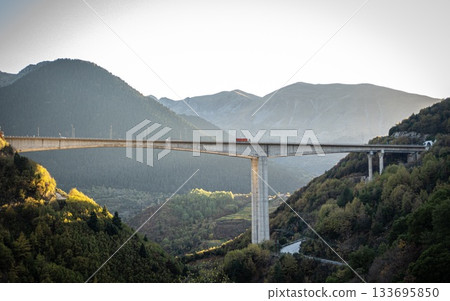 Highway Bridge from Metsovo and Anilio. Red Truck. European route E90 Highway Bridge from Metsovo and Anilio. Red Truck. European route E90 133695850