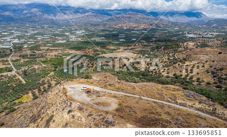 Aerial View of Olive Trees sorrounding Phaistos Palace. Crete. Greece. Aerial View of Olive Trees sorrounding Phaistos Palace. Crete. Greece. 133695851